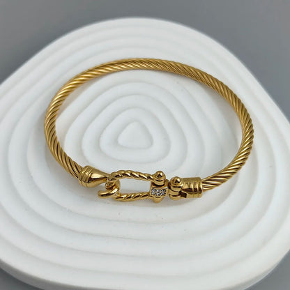 New steel wire button pattern horseshoe gold-plated stainless steel bracelet 18K, high quality waterproof couple bracelet, wife